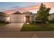 Charming single-Gathering home with a well-manicured lawn and a two-car garage at 1098 Old Windsor Way, Spring Hill, FL 34609