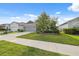 Attractive home with a well-kept lawn, gray exterior, and a two-car garage, exuding suburban charm at 1098 Old Windsor Way, Spring Hill, FL 34609