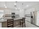 Bright kitchen featuring a large island, stainless steel appliances, and stylish pendant lighting at 1098 Old Windsor Way, Spring Hill, FL 34609