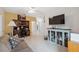 Comfortable living room featuring neutral colors, stylish furniture, and tiled flooring at 1098 Old Windsor Way, Spring Hill, FL 34609