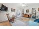 Spacious living room with neutral carpet, comfortable furniture, and tasteful decor at 1098 Old Windsor Way, Spring Hill, FL 34609