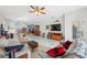 Spacious living room with tile floors, integrated kitchen/dining area and comfortable seating at 1098 Old Windsor Way, Spring Hill, FL 34609