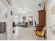 Relaxing living area with natural light, neutral color palette, and tile flooring at 1098 Old Windsor Way, Spring Hill, FL 34609