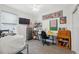 Bright office space featuring functional furniture, a TV, and lots of natural light at 1098 Old Windsor Way, Spring Hill, FL 34609