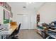 Well-lit office or craft room with tiled floors, storage, and a view of another room at 1098 Old Windsor Way, Spring Hill, FL 34609