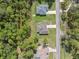 Overhead aerial view of three houses, set apart from each other by trees at 11034 Flock Ave, Weeki Wachee, FL 34613
