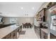 Eat-in kitchen with stone counters, stainless steel appliances, bar seating and dining area at 11034 Flock Ave, Weeki Wachee, FL 34613