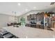 Eat-in kitchen with stone counters, stainless steel appliances, bar seating and dining area at 11034 Flock Ave, Weeki Wachee, FL 34613