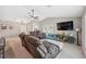 Spacious living room with vaulted ceilings and view of the kitchen at 11034 Flock Ave, Weeki Wachee, FL 34613
