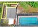 An aerial view of the backyard, pool, and shed, outlined in yellow at 1131 Bentley Ave, Spring Hill, FL 34608