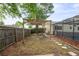 A fenced backyard with an awning over a seating area at 1131 Bentley Ave, Spring Hill, FL 34608