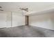 Finished basement with carpet, closet, and ceiling fan at 1131 Bentley Ave, Spring Hill, FL 34608