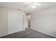 Bedroom featuring plush carpeting, neutral paint, and double door closet for ample storage at 1131 Bentley Ave, Spring Hill, FL 34608