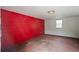 An empty shed interior with red block wall and concrete floor at 1131 Bentley Ave, Spring Hill, FL 34608