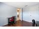 A spare bedroom showcasing the laminate wood flooring and neutral wall colors at 11524 Meadow Dr, Port Richey, FL 34668