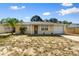Charming single-story home featuring an attached garage, and a well-maintained front yard at 11524 Meadow Dr, Port Richey, FL 34668