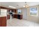 Well-equipped kitchen with stainless steel appliances, ample counter space, and tile flooring at 11524 Meadow Dr, Port Richey, FL 34668