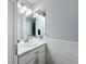 Clean bathroom featuring a vanity with a marble countertop and subway tile backsplash at 11722 Carissa Ln # 49A, New Port Richey, FL 34654