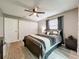 Spacious bedroom with a large closet and an area rug over light gray floors at 11722 Carissa Ln # 49A, New Port Richey, FL 34654