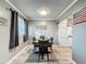 Charming dining area with modern flooring and decorative wall art at 11722 Carissa Ln # 49A, New Port Richey, FL 34654