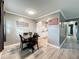 Cozy dining area featuring a wooden table set and view to the kitchen at 11722 Carissa Ln # 49A, New Port Richey, FL 34654