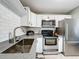 Updated kitchen with stainless appliances, granite counters, and lots of cabinet space at 11722 Carissa Ln # 49A, New Port Richey, FL 34654
