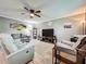 Relaxing living room with comfortable seating, ceiling fan, and decorative rug at 11722 Carissa Ln # 49A, New Port Richey, FL 34654