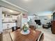 Open floor plan featuring dining area, kitchen, and a comfortable living room at 11722 Carissa Ln # 49A, New Port Richey, FL 34654