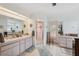 Bright bathroom featuring double sinks, walk-in shower, and great natural light at 12295 Clarendon Ct, Spring Hill, FL 34609