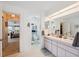 Bathroom featuring double sinks and a connecting door to the main bedroom at 12295 Clarendon Ct, Spring Hill, FL 34609