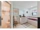 Bright bathroom with shower, vanity, and garden tub with tile surround at 12295 Clarendon Ct, Spring Hill, FL 34609