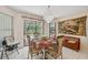 Bright dining area with views of the backyard pool and sliding door access at 12295 Clarendon Ct, Spring Hill, FL 34609