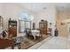 Elegant dining room with a chandelier, hardwood furniture, and an area rug at 12295 Clarendon Ct, Spring Hill, FL 34609