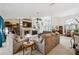 Inviting living room with cozy sofas, a fireplace, and lots of natural light at 12295 Clarendon Ct, Spring Hill, FL 34609