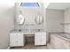 Bathroom features double sinks, vanity, and a large soaking tub with tiled surround at 13125 Jessica Dr, Spring Hill, FL 34609
