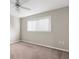 Neutral bedroom with carpet floors and a large window providing natural light at 13125 Jessica Dr, Spring Hill, FL 34609