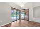 Dining area featuring hardwood floors and sliding glass doors leading to the pool at 13125 Jessica Dr, Spring Hill, FL 34609