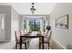 Inviting dining room featuring a large window and a well-set dining table for six at 13125 Jessica Dr, Spring Hill, FL 34609