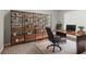 Stylish home office featuring a wood desk and built-in shelves with drawers at 13125 Jessica Dr, Spring Hill, FL 34609