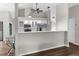 Bright kitchen area with stainless steel appliances and bar-style counter seating at 13125 Jessica Dr, Spring Hill, FL 34609