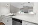 Kitchen with marble countertops and white cabinetry at 13125 Jessica Dr, Spring Hill, FL 34609