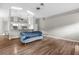 Open-concept living space with wood floors and views of kitchen at 13125 Jessica Dr, Spring Hill, FL 34609