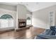 Bright living room with vaulted ceilings, featuring a fireplace and large windows at 13125 Jessica Dr, Spring Hill, FL 34609