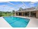 Enjoy the lovely in-ground pool and patio of this fantastic home at 13125 Jessica Dr, Spring Hill, FL 34609