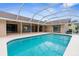 Gorgeous screened pool provides seamless indoor/outdoor living at 13125 Jessica Dr, Spring Hill, FL 34609