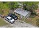 Aerial view of the garage and driveway showcasing ample parking space and storage at 13345 Convent Garden Rd, Brooksville, FL 34613