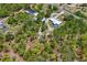 The property includes a home, outbuildings, natural foliage, and a long driveway at 13345 Convent Garden Rd, Brooksville, FL 34613
