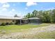The backyard includes a patio, pool, and a spacious area for outdoor enjoyment at 13345 Convent Garden Rd, Brooksville, FL 34613