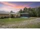 The backyard features a screened-in pool next to the home, perfect for outdoor enjoyment at 13345 Convent Garden Rd, Brooksville, FL 34613