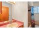 Bathroom with sink, vanity, toilet, and bathtub/shower combo at 13345 Convent Garden Rd, Brooksville, FL 34613